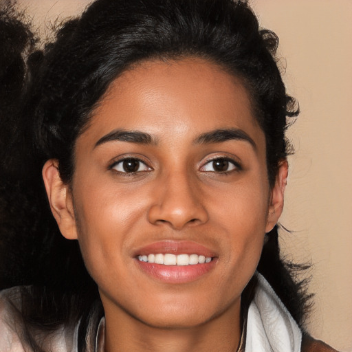 Joyful latino young-adult female with long  brown hair and brown eyes