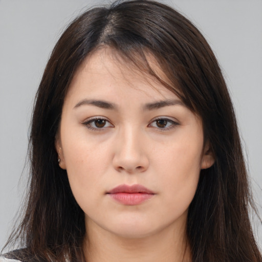 Neutral white young-adult female with long  brown hair and brown eyes