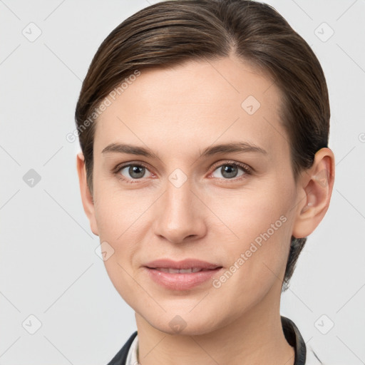 Joyful white young-adult female with short  brown hair and grey eyes