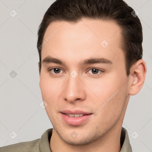 Joyful white young-adult male with short  brown hair and brown eyes