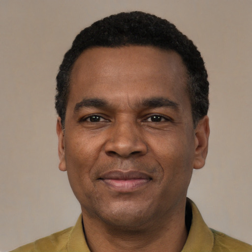 Joyful latino adult male with short  black hair and brown eyes