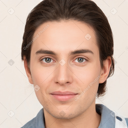 Joyful white young-adult male with medium  brown hair and brown eyes