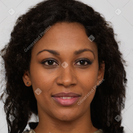 Joyful black young-adult female with long  brown hair and brown eyes