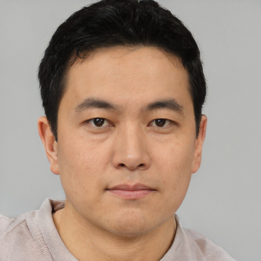 Neutral asian young-adult male with short  black hair and brown eyes