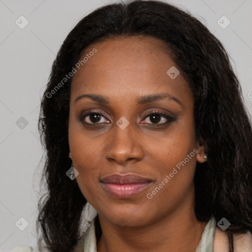 Joyful black young-adult female with long  brown hair and brown eyes