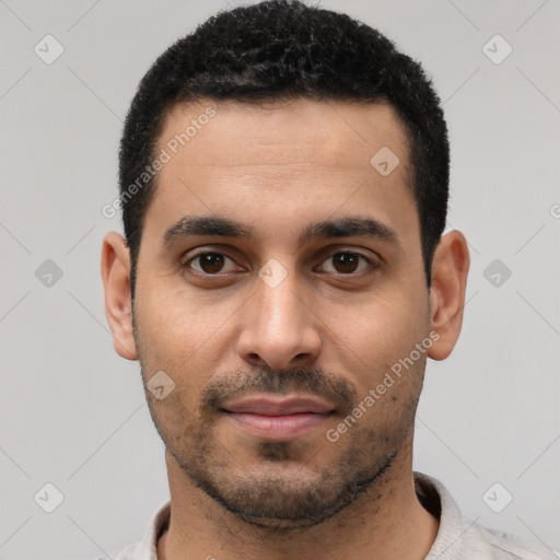 Joyful latino young-adult male with short  black hair and brown eyes