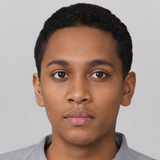 Neutral black young-adult male with short  black hair and brown eyes