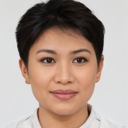 Joyful asian young-adult female with short  brown hair and brown eyes