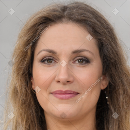 Joyful white adult female with long  brown hair and brown eyes