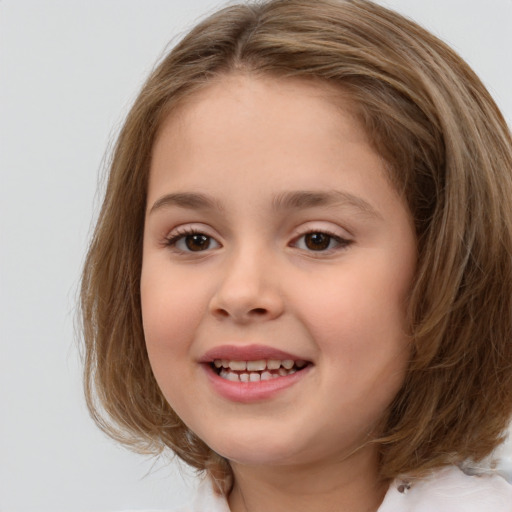 Joyful white child female with medium  brown hair and brown eyes