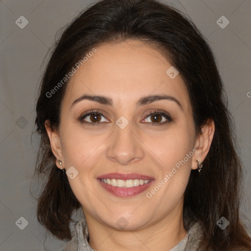 Joyful white adult female with medium  brown hair and brown eyes