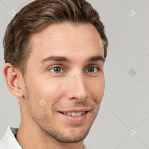 Joyful white young-adult male with short  brown hair and brown eyes