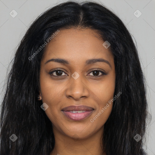 Joyful black young-adult female with long  black hair and brown eyes