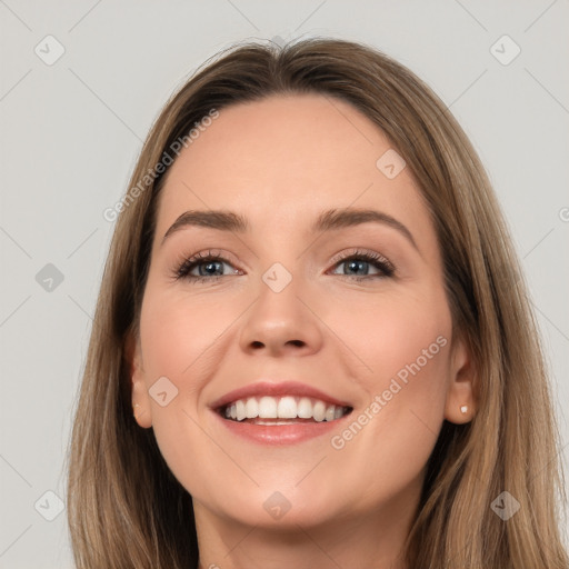 Joyful white young-adult female with long  brown hair and grey eyes