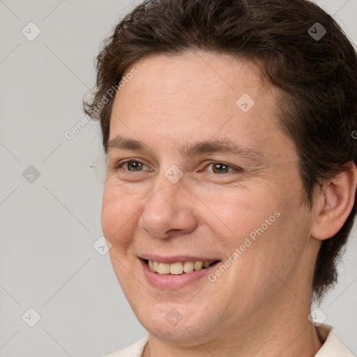 Joyful white adult female with short  brown hair and brown eyes