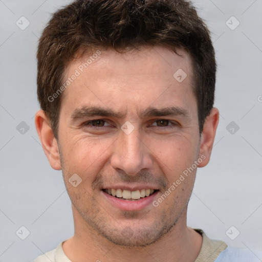 Joyful white adult male with short  brown hair and brown eyes