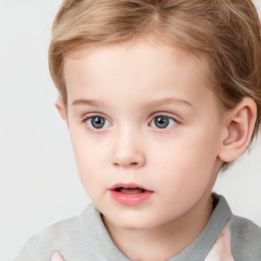 Neutral white child female with short  brown hair and grey eyes