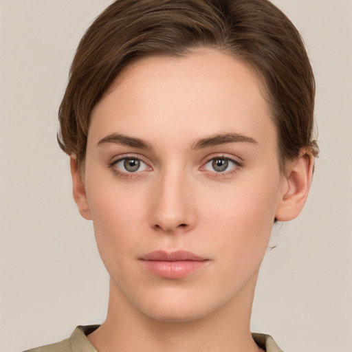 Neutral white young-adult female with short  brown hair and grey eyes