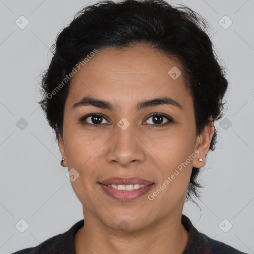 Joyful latino young-adult female with short  brown hair and brown eyes