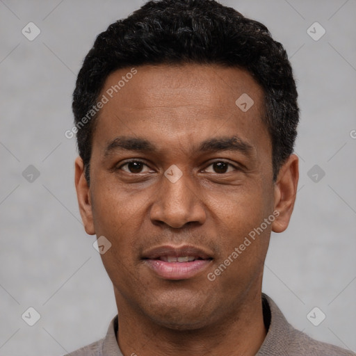 Joyful latino adult male with short  black hair and brown eyes