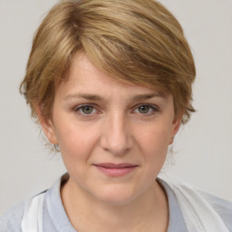 Joyful white young-adult female with medium  brown hair and blue eyes