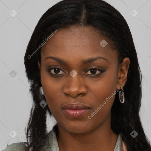 Joyful black young-adult female with long  black hair and brown eyes