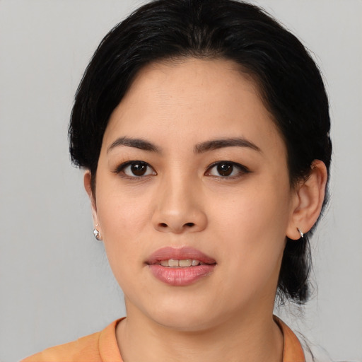 Joyful asian young-adult female with medium  black hair and brown eyes