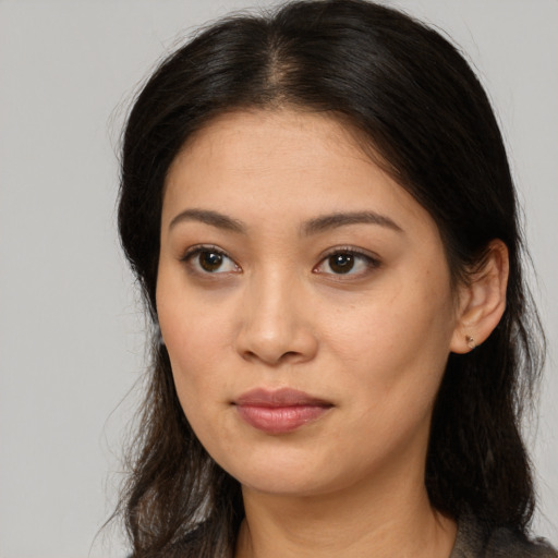 Neutral asian young-adult female with long  brown hair and brown eyes
