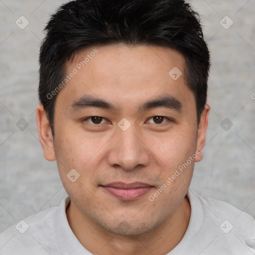 Joyful asian young-adult male with short  brown hair and brown eyes