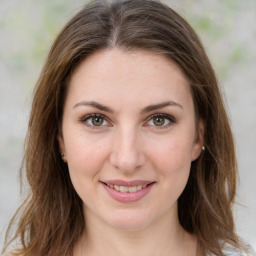 Joyful white young-adult female with medium  brown hair and green eyes