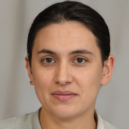 Joyful white young-adult female with short  brown hair and brown eyes