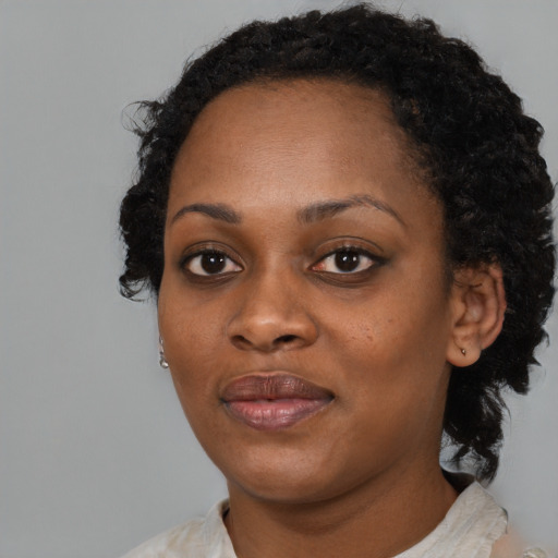 Neutral black young-adult female with medium  black hair and brown eyes