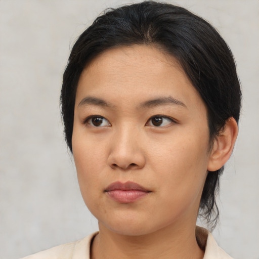 Neutral asian young-adult female with medium  brown hair and brown eyes