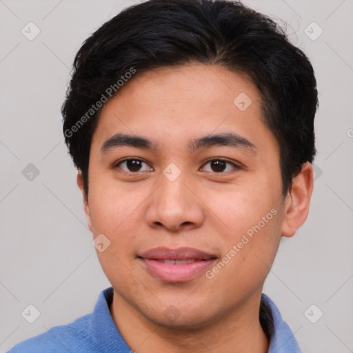 Joyful asian young-adult male with short  brown hair and brown eyes