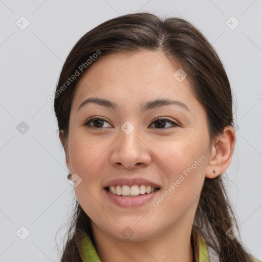 Joyful white young-adult female with long  brown hair and brown eyes