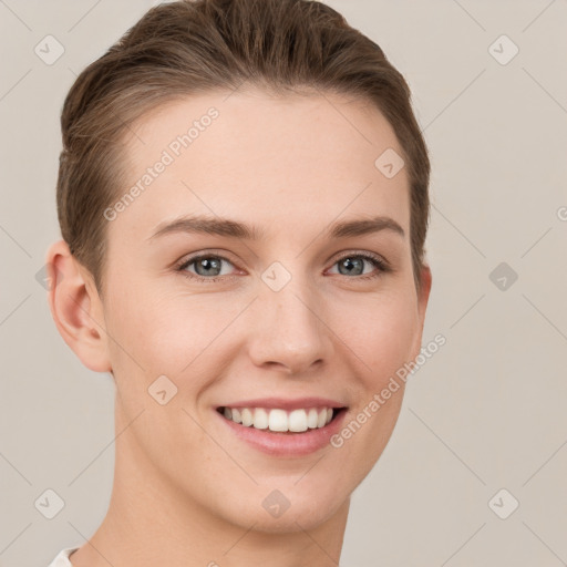 Joyful white young-adult female with short  brown hair and grey eyes