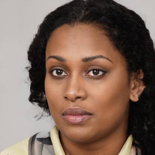 Neutral black young-adult female with long  black hair and brown eyes