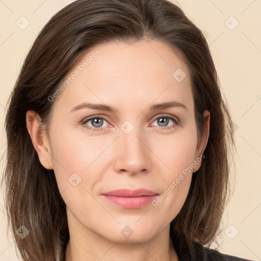 Joyful white young-adult female with long  brown hair and grey eyes