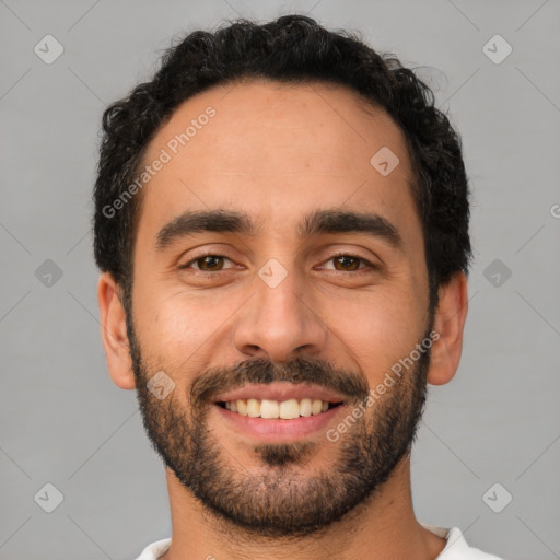 Joyful latino young-adult male with short  black hair and brown eyes