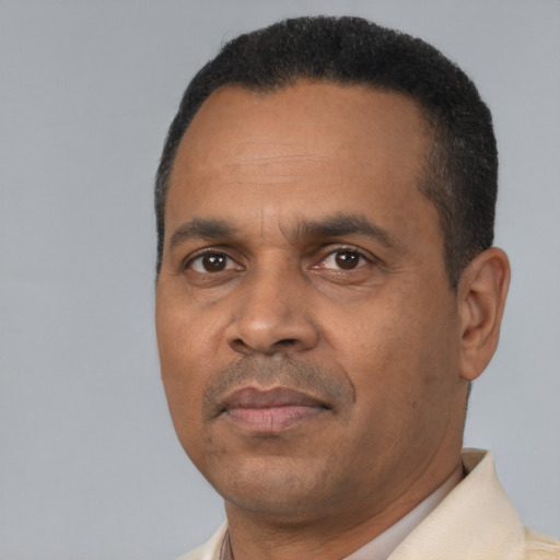 Neutral latino adult male with short  black hair and brown eyes