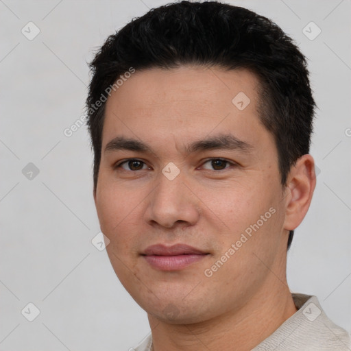 Joyful white young-adult male with short  black hair and brown eyes