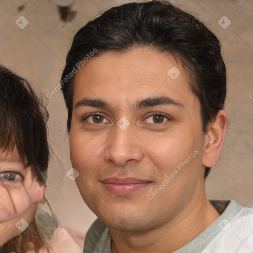 Joyful white young-adult male with medium  brown hair and brown eyes