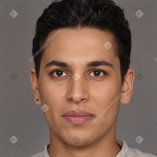 Joyful latino young-adult male with short  brown hair and brown eyes