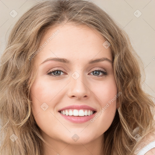 Joyful white young-adult female with long  brown hair and green eyes