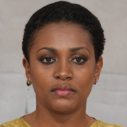 Neutral black young-adult female with short  black hair and brown eyes