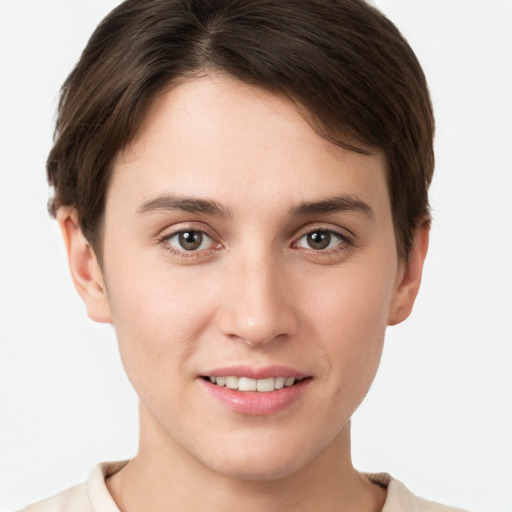 Joyful white young-adult female with short  brown hair and grey eyes