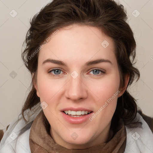 Joyful white young-adult female with medium  brown hair and blue eyes