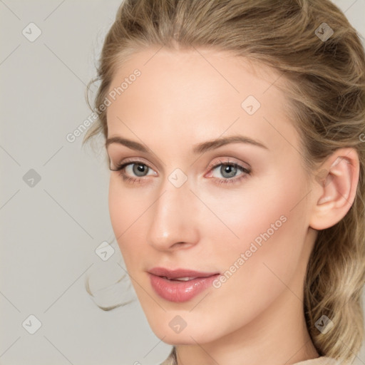 Joyful white young-adult female with long  brown hair and blue eyes