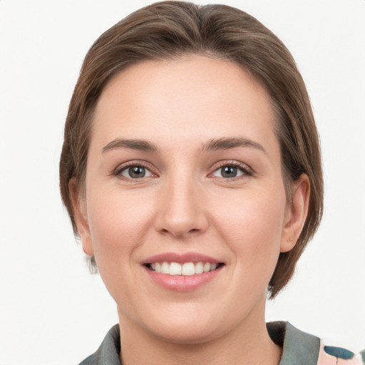 Joyful white young-adult female with medium  brown hair and grey eyes