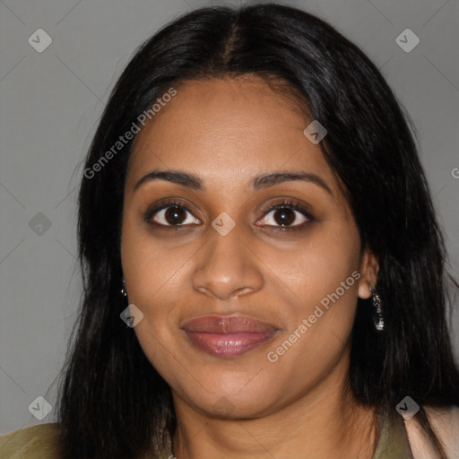 Joyful black young-adult female with long  black hair and brown eyes